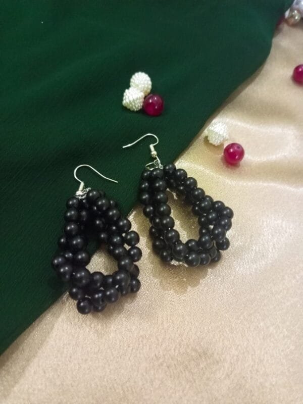 Twisted Black Beaded Hanging Earrings by CHAMMAQ – Bold & Elegant ✨