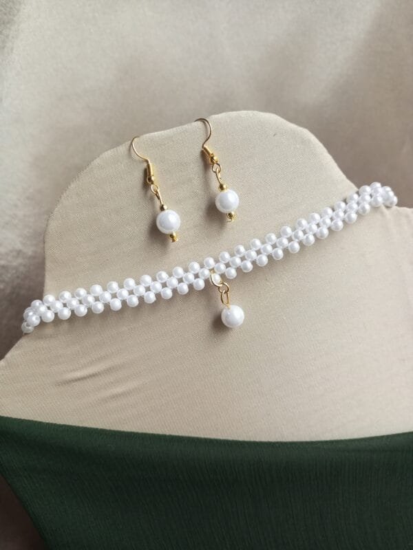 Elegant White Beaded Choker with earrings by CHAMMAQ.