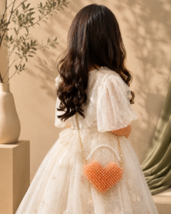 Mini beaded bag in heart shape with gold-tone chain by CHAMMAQ